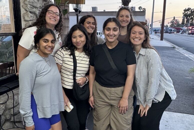 residents taking a photo outside a Thai restaurant 