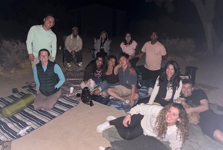 residents taking a photo at Joshua Tree at night