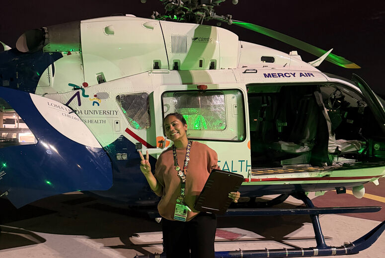 DR. SREERAM PREPARING FOR A NIGHTTIME TRANSPORT VIA HELICOPTER