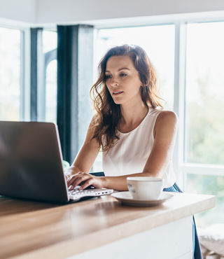 Woman looking up information on her laptop