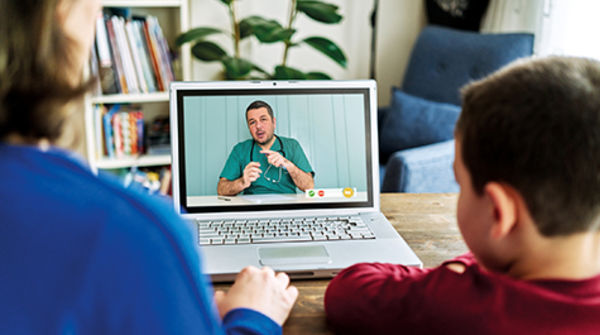 Family call with a doctor over computer