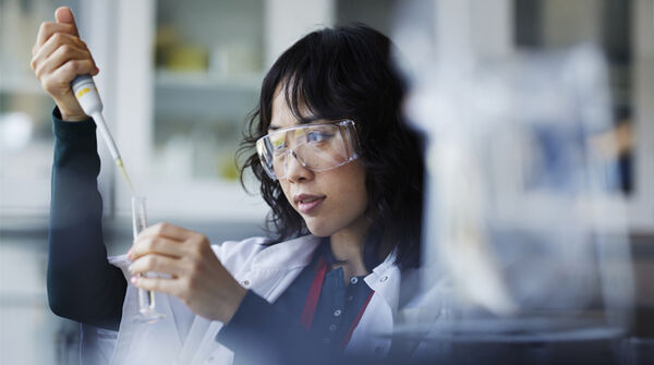 lab scientist holding liquid tube