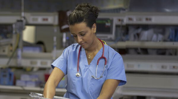 nurse caring for newborn