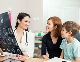Pediatric Neurologist Discussing Treatment with Family