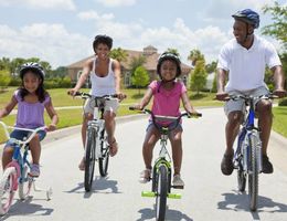 Family of 4 riding bicycles