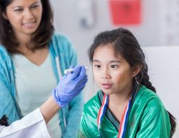 Child being examined for concussion