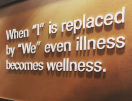 Banner that says when I is replaced by we even illness becomes wellness