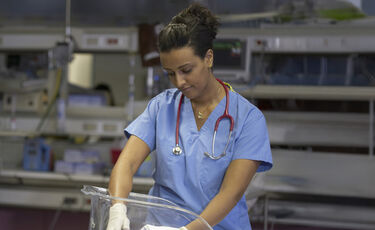 nurse caring for newborn
