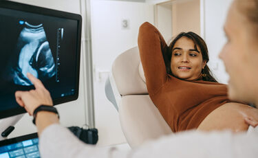 nurse and woman looking at monitor