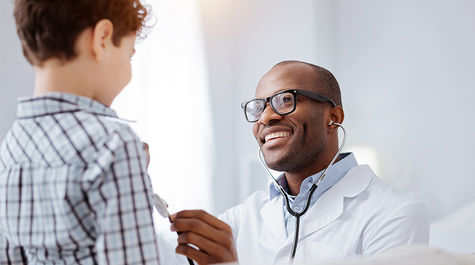 happy child with male doctor